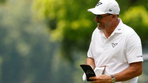 Phil Mickelson smiles during a LIV Golf tournament in Virginia.